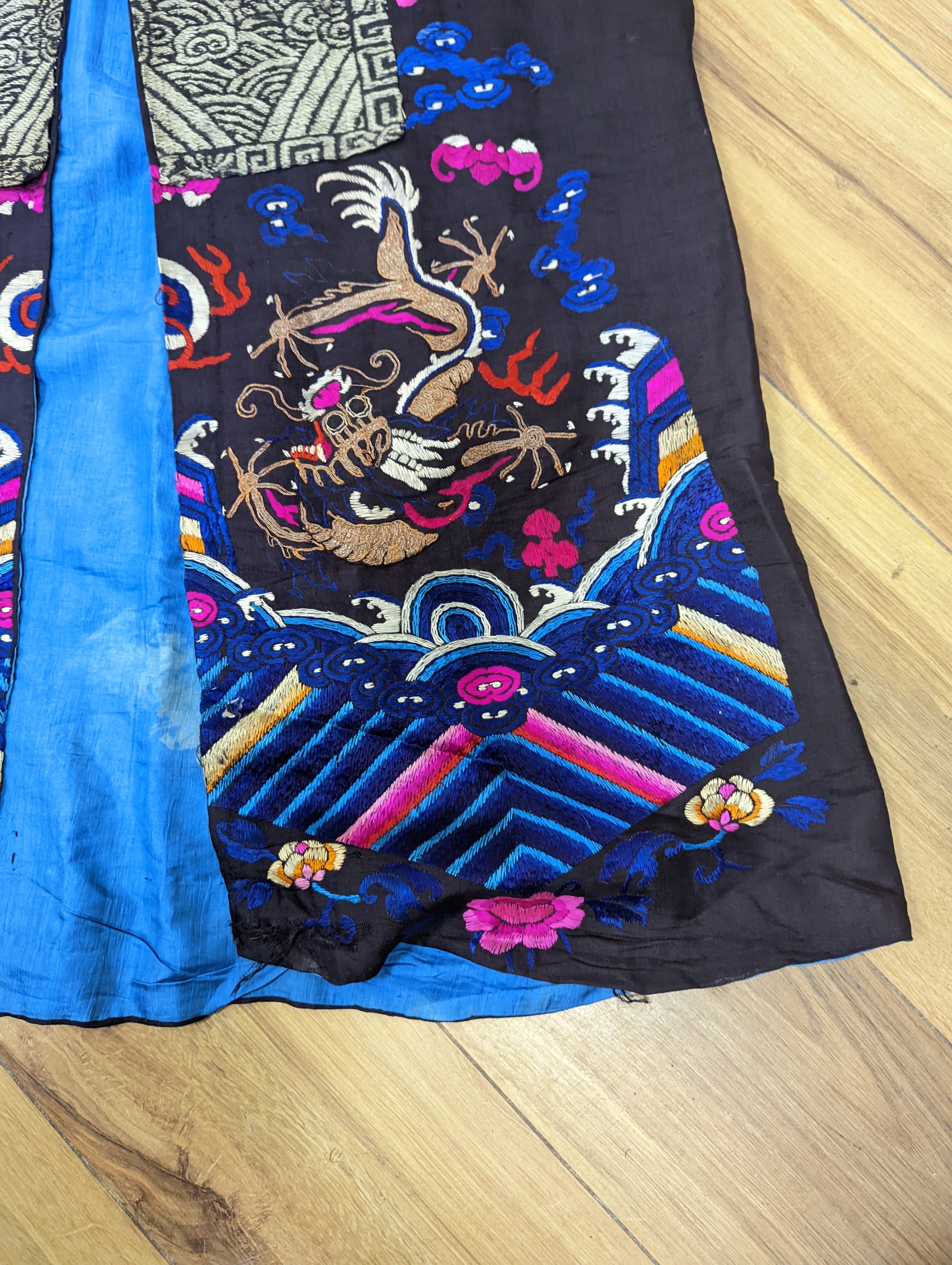 A 1920's Chinese dragon embroidered waistcoat, a cream silk drawn thread dress and a silk crepe black and patterned reversible kimono (3 items).